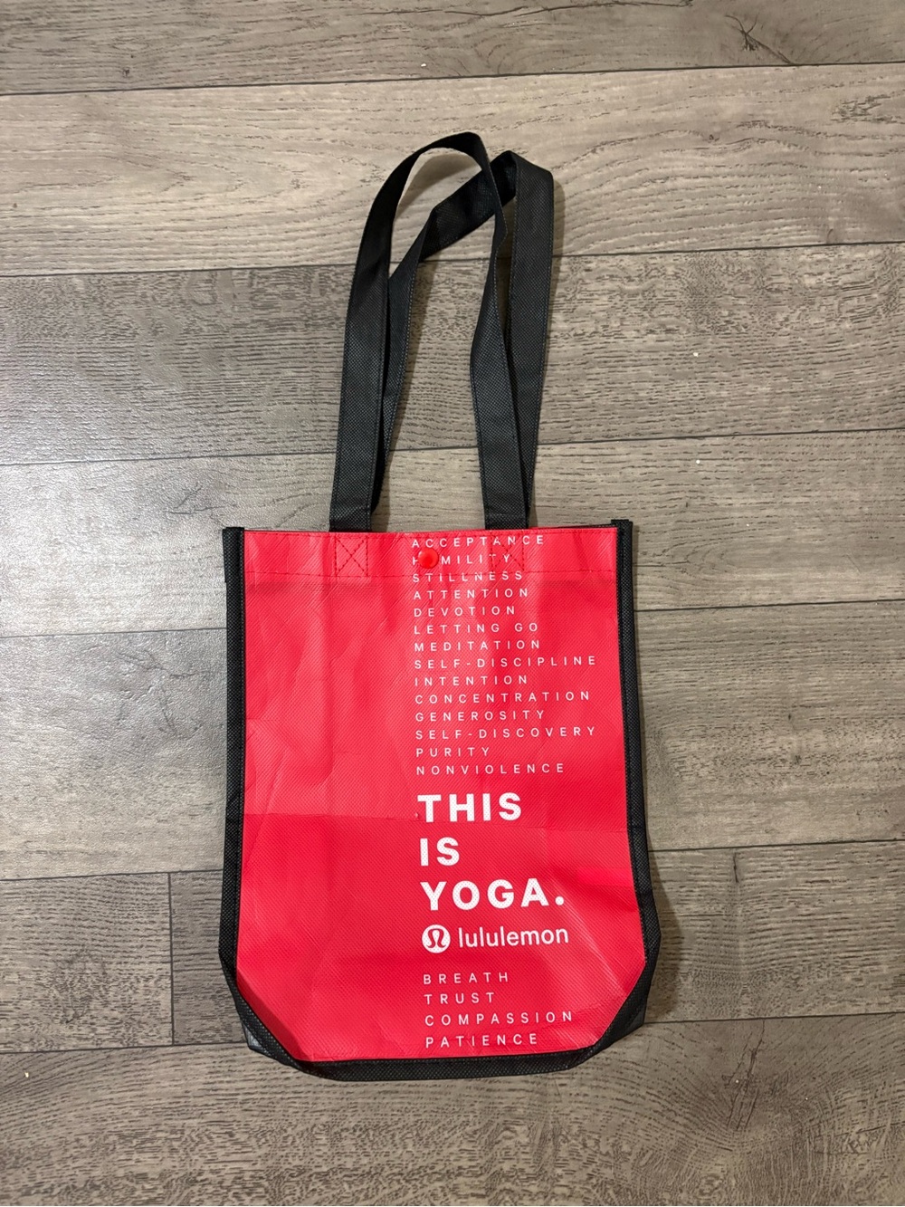 lululemon athletica red tote with black straps